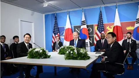 AFP US President Joe Biden (C) flanked by US Secretary of Defense Lloyd Austin (C/R) and Secretary of State Antony Blinken (C/L) sits with South Korea's President Yoon Suk-Yeol (L) and Japan's Prime Minister Fumio Kishida (R) during a tri-lateral meeting on the sidelines of the NATO summit at the Ifema congress centre in Madrid, on June 29, 2022.