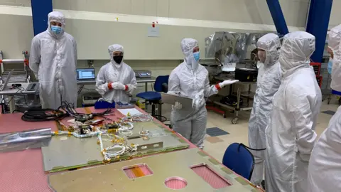 Lockheed Martin Space scientists working on satellite