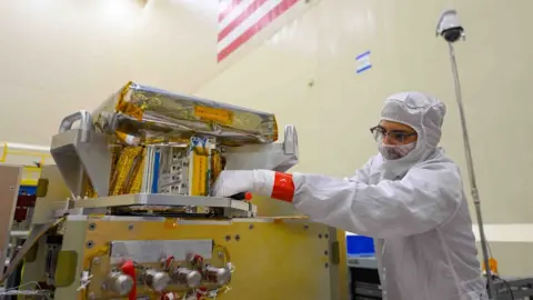 Lockheed Martin Space physicist working on satellite