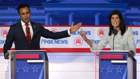 Getty Images Vivek Ramaswamy and Nikki Haley at the first debate in Wisconsin