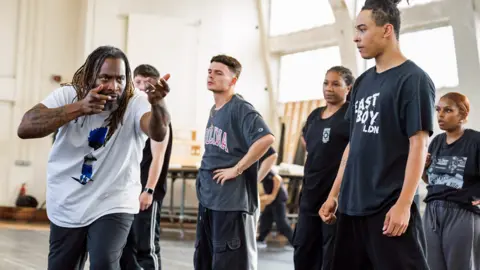Tristram Kenton Free Your Mind choreographer Kenrick Sandy and cast members in rehearsals