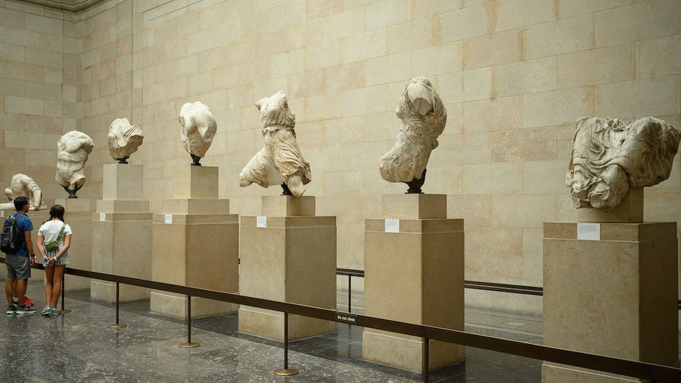 Visitors at the British Museum look at busts from the Parthenon Sculptures collection