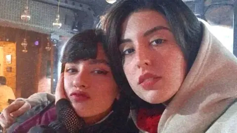 Social media Undated photo showing Nika Shakarami (L), who was killed during protests in Iran in September 2022, and her sister Aida Shakarami (R)