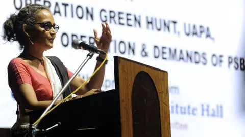 AFP Indian writer and activist Arundhati Roy gestures as she addresses a gathering of intellectuals and students in Kolkata on April 14, 2010.