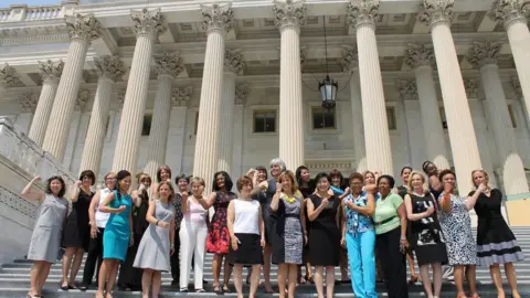 Twitter / @RepRoybalAllard Women gather on the steps of Congress on Friday wearing outfits with no sleeves