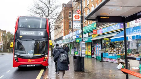 TfL A bus stop in Peckham and a No 78 red double decker bus