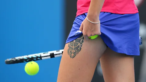 Athletes, like Czech tennis player Karolina Pliskova, have long had exposed tattoos. Will they become more accepted at the office? (Mark Kolbe/Getty Images)