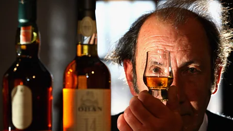 David Campbell views a whisky in Dalwhinnie, Scotland. (Jeff Mitchell/Getty)