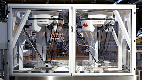 Adjacent robot arms coordinate their activity and can handle more than just food (ABB)