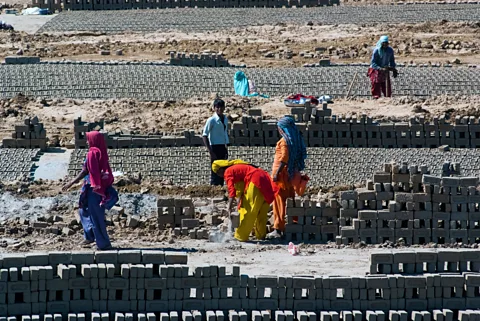 Alamy Stock Photo Repetitive, labourious tasks, like the brick-laying seen here in Uttar Pradesh, are especially at risk of being replaced with smart machines (Credit: Alamy Stock Photo)