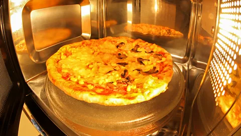 Getty Images Pizzas in a microwave go soggy because the air does not become dry enough to evaporate moisture (Credit: Getty Images)