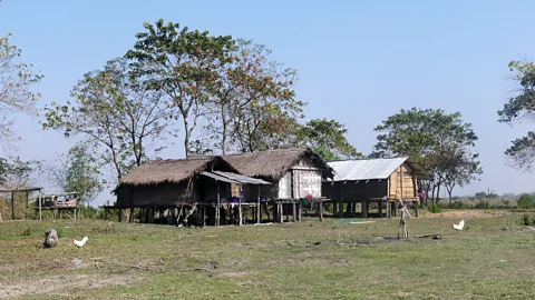 Jules Montague The islanders’ homes stand on stilts to defend against frequent floods (Credit: Jules Montague)