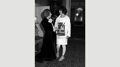 PA In 1984 Katharine Hamnett met the UK’s then-prime minister Margaret Thatcher – the designer wore her infamous 58% Don’t Want Pershing T-shirt (Credit: PA)