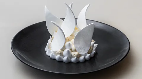 Nikki To Peter Gilmore’s pavlova in the shape of the Sydney Opera House is served at Bennelong Restaurant (Credit: Nikki To)