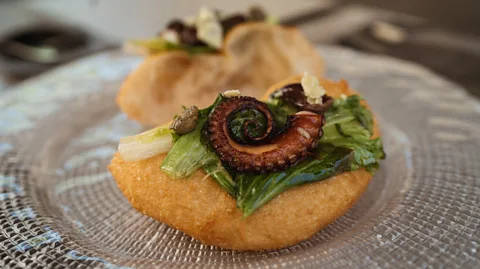 Erika Hobart Modern chefs like Isabella de Cham are elevating pizza fritta from its rustic roots by using ingredients like octopus (Credit: Erika Hobart)