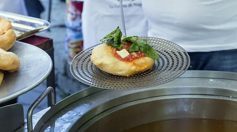 Marialba.italia/Getty Images Although Neapolitan pizza is most often associated with Naples, fried pizza is the city’s beloved street food (Credit: Marialba.italia/Getty Images)