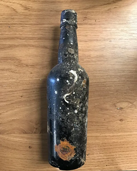 Steve Hickman When opened, the beer inside the bottles found on the Wallachia had a far from appetising odour, but the yeast they contain could be invaluable (Credit: Steve Hickman)