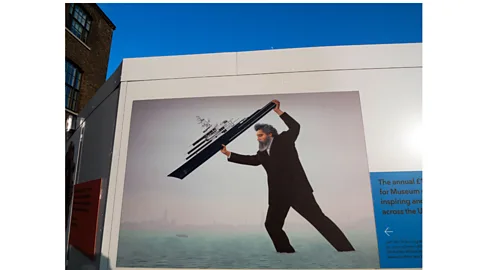 Alamy UK artist Jeremy Deller's 2014 mural depicts William Morris as 'an activist giant, a colossus of history', hurling a superyacht into the Venice lagoon (Credit: Alamy)