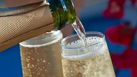 Ian Shaw/Alamy Champagne poured straight down into a flute will result in about a million bubbles, but tilting the glass will boost that number further (Credit: Ian Shaw/Alamy)