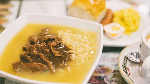 tuimages.com/Alamy Popular dishes include satay beef noodles (pictured) and scrambled egg sandwiches (Credit: tuimages.com/Alamy)