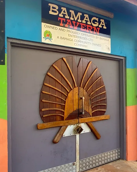Sarah Reid The door of the Bamaga Tavern is fashioned on a Torres Strait Islander Dhari headdress (Credit: Sarah Reid)