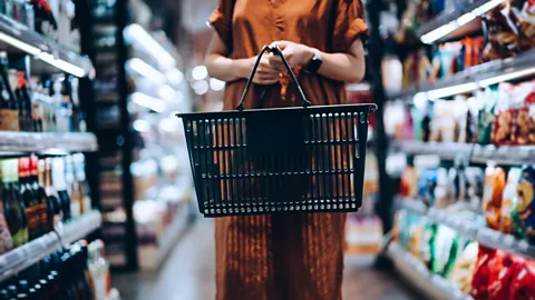 Yiu Yu Hoi/Getty Images Nudging good behaviour – such as buying healthier food when shopping – has become a global industry (Credit: Yiu Yu Hoi/Getty Images)