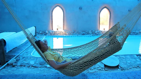 Israel Images/Alamy Visitors to Lotan do things like organic farming and eco-friendly architecture for five hours and then have the rest of the day to themselves (Credit: Israel Images/Alamy)