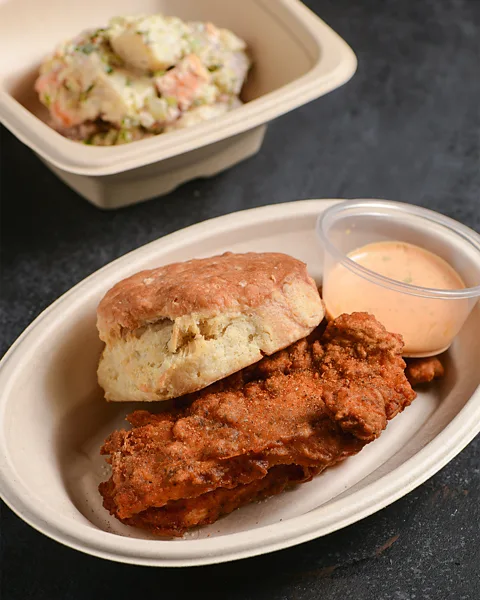 Max Flatow HoneyBunny makes a biscuit sandwich with pan-fried chicken and a shiitake bechamel (Credit: Max Flatow)