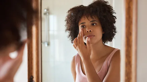 Getty Images A woman applying moisturiser (Credit: Getty Images)