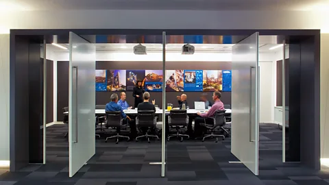 Getty Images Woman presenting to room