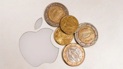 Getty Images Apple logo next to euro coins