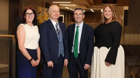 Ulster University (L-R): Dr Susan Hawthorne, Course Director Advancing Animal Healthcare and Practice; Ulster University Vice Chancellor Professor Paul Bartholomew; DAERA Minister Andrew Muir, Bethan Phiney RVN, Course Director Veterinary Nursing. 