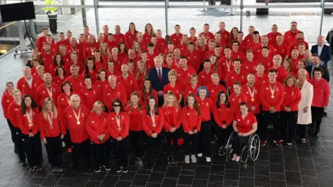 Wales News Service Members of Team Wales athletes with Carwyn Jones in the Senedd