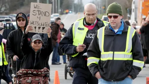 Reuters Police remove a man from a protest in support of Wet'suwet'en hereditary chiefs