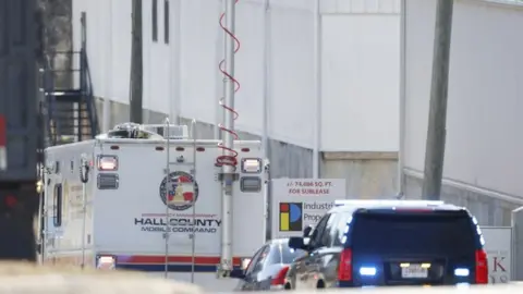 EPA Police and fire officials outside the Prime-Pak Foods Inc. food packing plant following a reported chemical leak which officials indicate has killed multiple workers and sent many more to the hospital in Gainesville, Georgia, USA, 28 January 2021