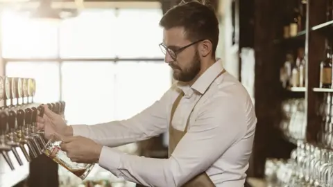 Getty Images Pub worker pouring pint