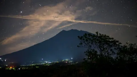 AFP/Getty Starlit long exposure showing Bali's volcano silouette
