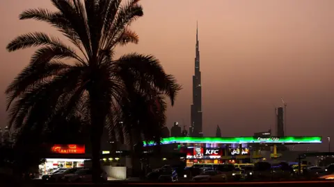 Getty Images A petrol station and fast food restaurant in Dubai