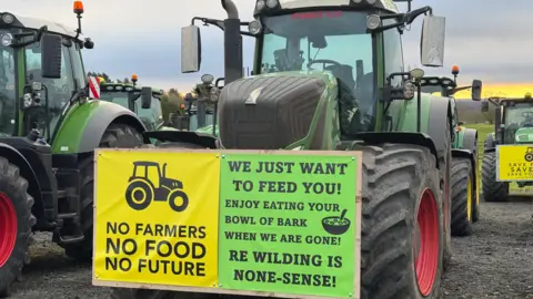 BBC A picture of a tractor with a sign on it saying No Farmers, No Food, No Future.