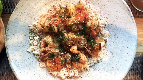 David Farley The crab rice dish at Husk is like a rice-and-seafood porridge (Credit: David Farley)