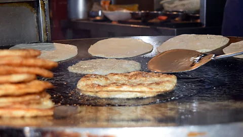 Aysha Imtiaz Paratha is fried until flaky and crisp (Credit: Aysha Imtiaz)