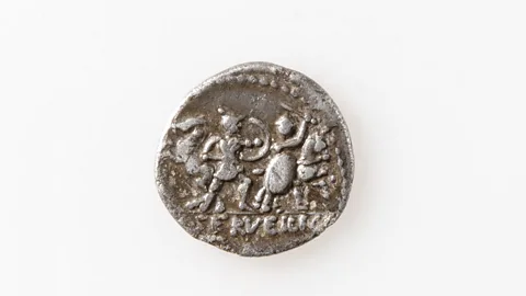 Archaeological Service of the Canton of Grisons A Roman coin found on a glacier in the Swiss Alps (Credit: Archaeological Service of the Canton of Grisons)