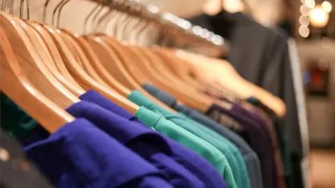 Getty Images Clothing rack in shop