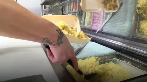 Preparing chips, cheese and gravy