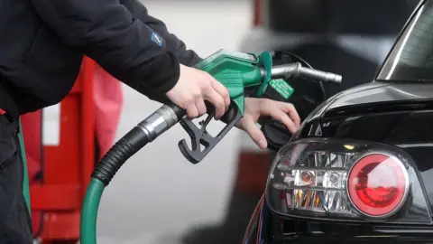 PA Petrol pump nozzle and a car