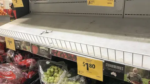 EPA Empty shelves where strawberries are normally displayed for sale in a Brisbane supermarket