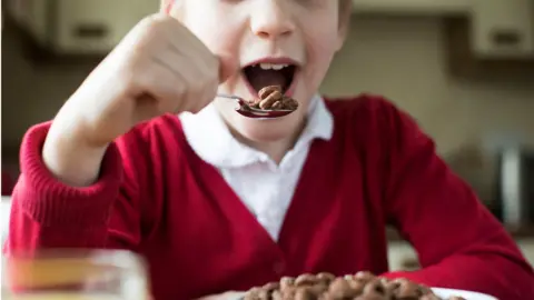 Getty Images Child eating chocolate cereal
