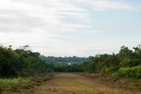 Alamy A small aircraft landing at Aldeia Baú, Para State, Brazil