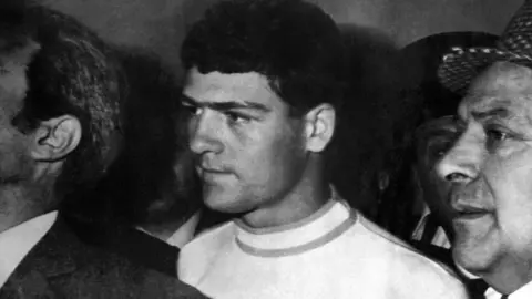 AFP/Getty Images Raffaele Minichiello under arrest in Rome on 1 November 1969