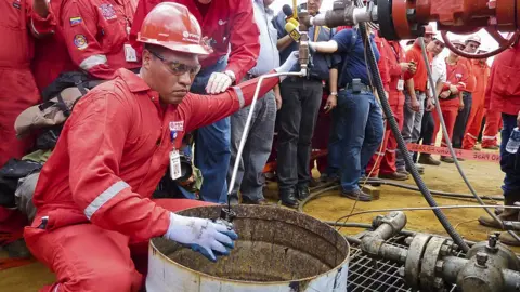 AFP Venezuelan oil workers